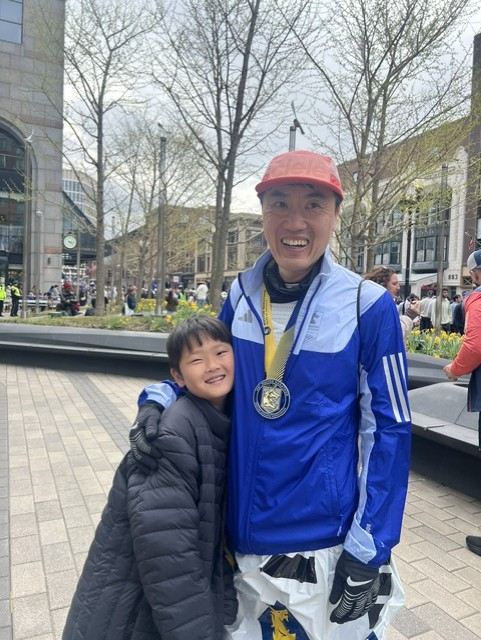 Peter with a finisher's medal after a marathon